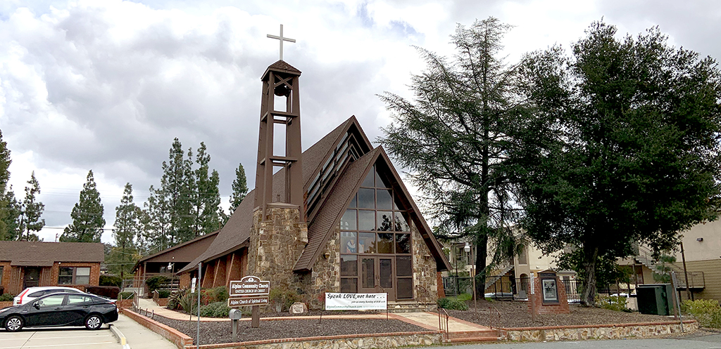 Street view of front of sanctuary with the tall steeple containing the bell on the left side